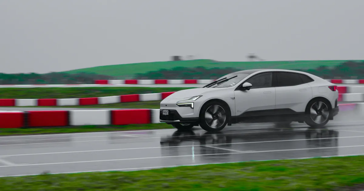 Electric vehicle driving on a wet test track